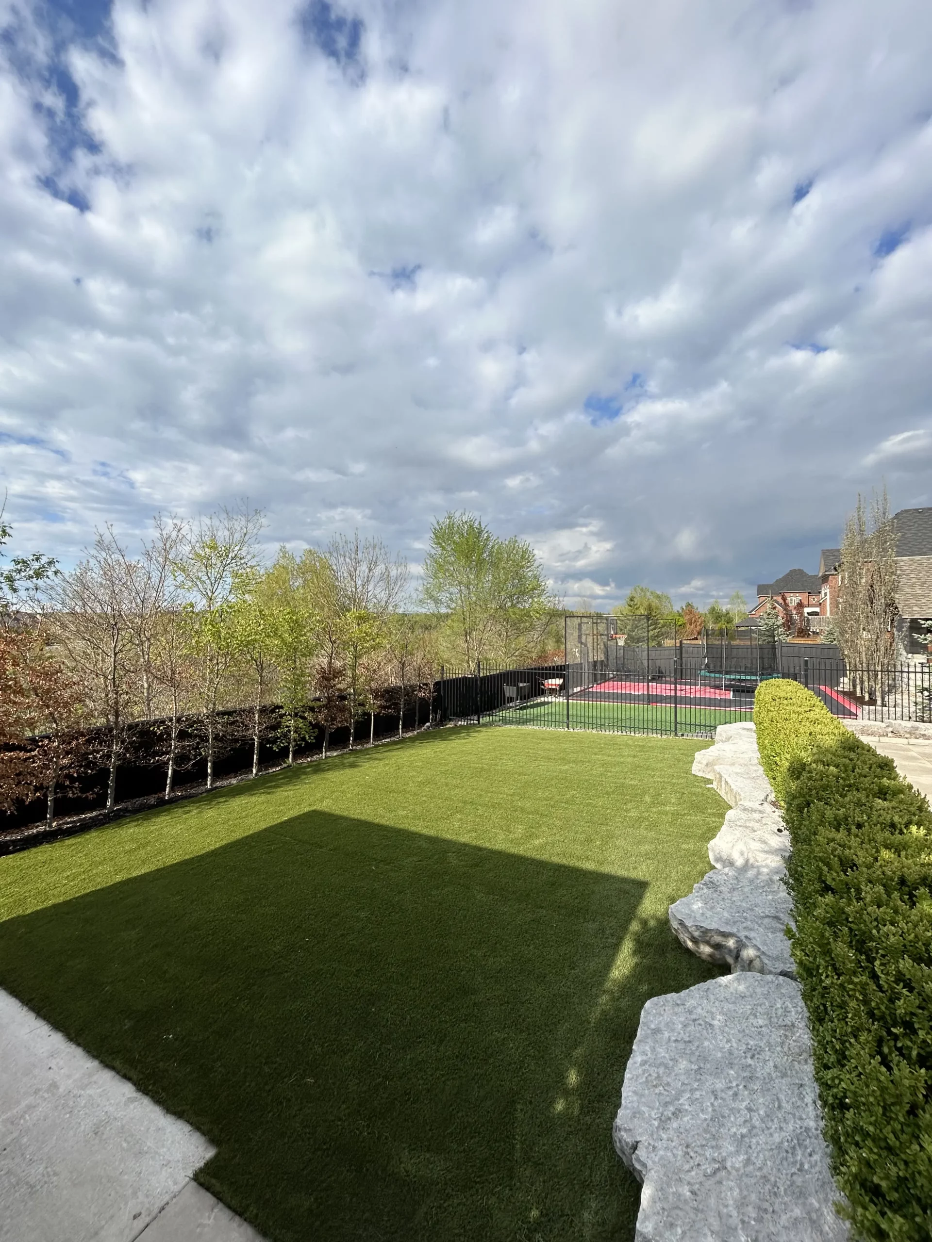 Backyard artificial grass installation in Whitby